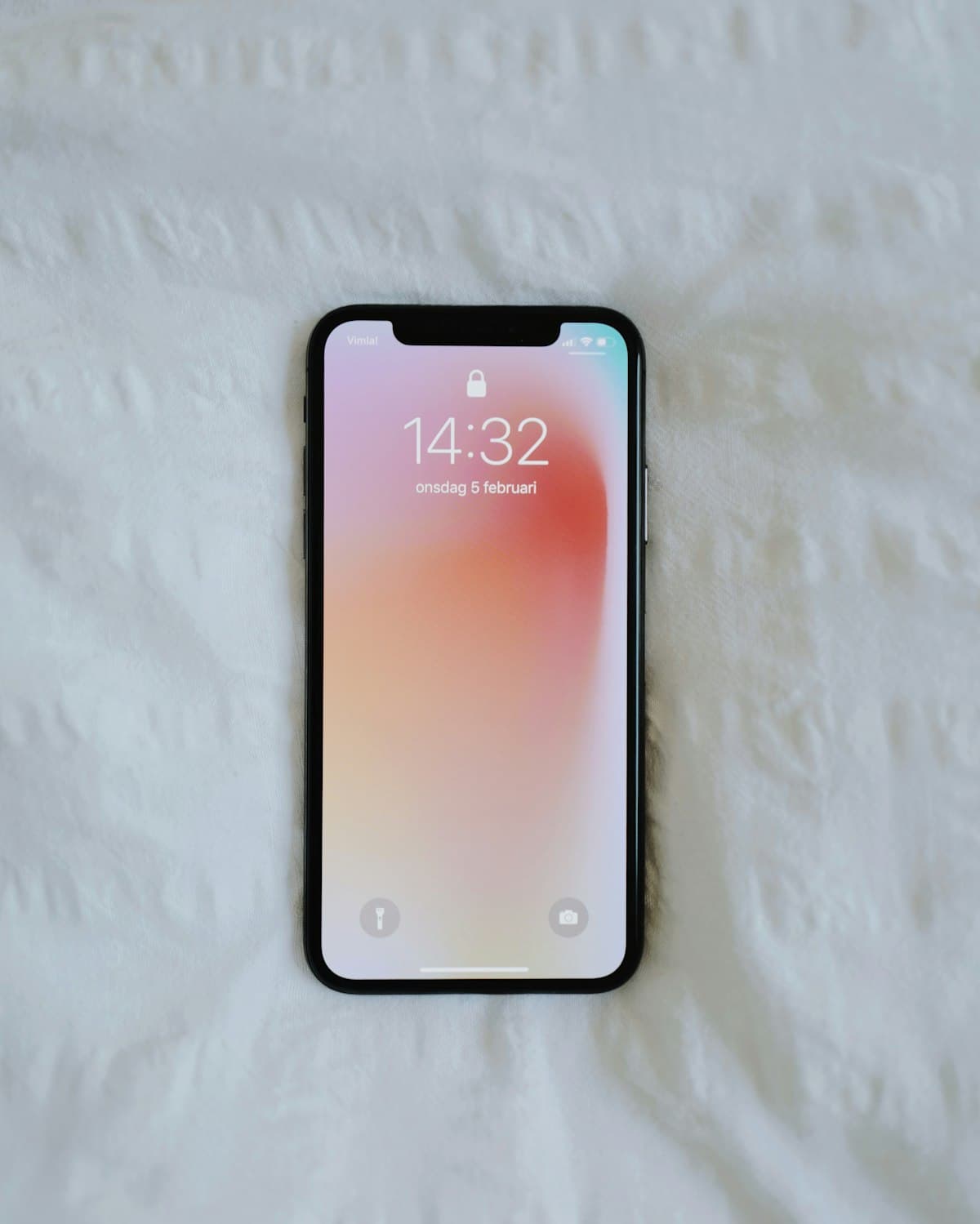 Smartphone lying on a white surface